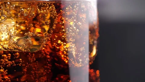 Cola with ice and bubble. Close-up glass of cold cola with ice rotation Stock-Footage 126195113