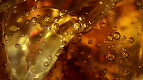 Cola with ice and bubbles in the glass. Close up soda soft drink. Slow motion. Vidéo 38992006