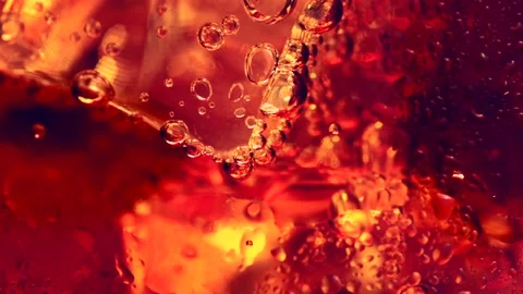 Cola with Ice and bubbles, macro shot. Abstract sweet food liquid background Video stock 130748638
