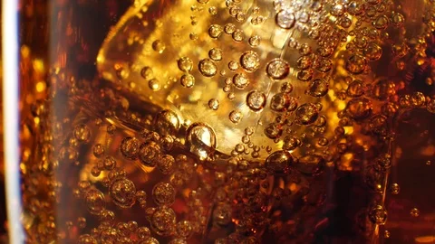 Cola with ice background. Large glass of cold coke with ice cubes close-up. 4k Stock Footage 84741087