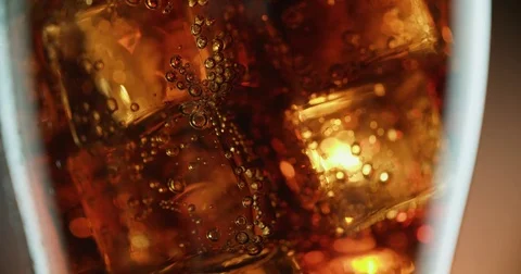 Cola with ice. close-up for a very large glass of cold coke with ice cubes 스톡 동영상 72377711