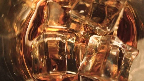 Cola with ice. close-up for a very large glass of cold coke with ice cubes Stock Footage 104669996