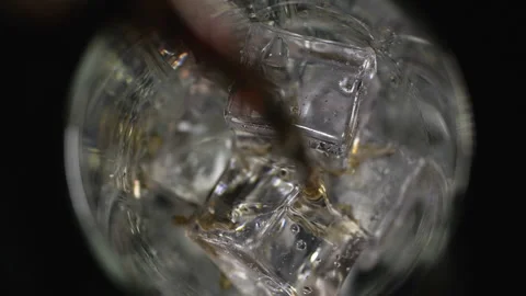 Cola with ice cubes  is poured on black background 스톡 동영상 133628235