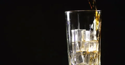 Cola with ice cubes  is poured on black background 스톡 동영상 133628294
