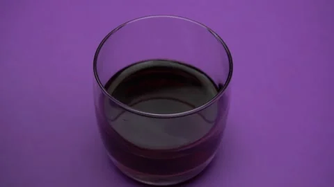 Cola with ice. Pouring Cola with Ice and bubbles in a glass. Slow motion. Close Stock Footage 85873227