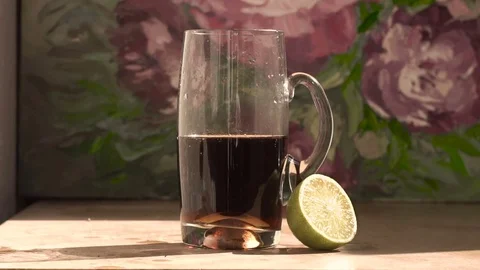 Cola with lime. Rum with cola. Slow motion Stock Footage 78196959