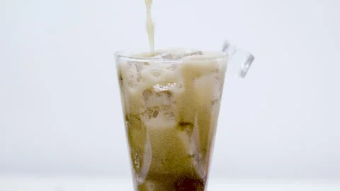 Cola or Dark Soda with Ice in Tall Glass Closeup Stock Footage 340124149