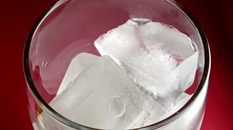 Cola poured onto ice cubes Stock Footage 64847524