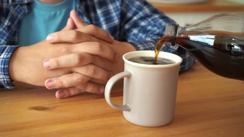 Cola is poured to the person sitting at the table Stock Footage 160950659