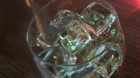 Cola pouring  into glass ice cubes nightclub Stock Footage 48729363