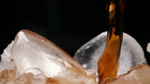 Cola pouring on ice Stock Footage 196180396