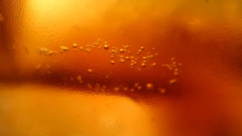 Cola soft drink bubbles and ice Vidéo 93835817