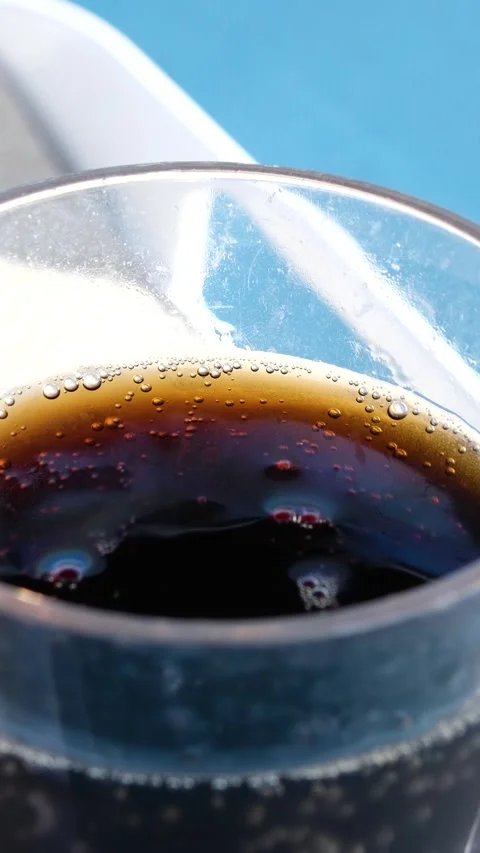 Cola soft drink with ice cubes, Close up of soda fizzy drink in Cold glass Stock Footage 317701643