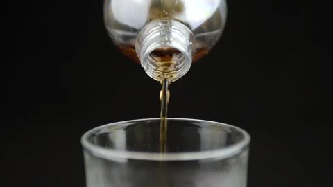 Cola soft drink poured in to a cold glass front close up view of photo 動画素材 130427663