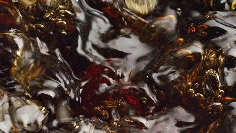 Cola Splash Close-Up with Fizzing Bubbles and Foam Stock Footage 346088034