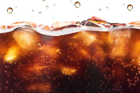 Cola Splashing background with soda bubble. Soft drink or Refreshment. Stock Photos