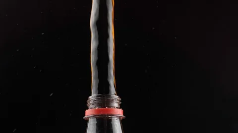 Cola splashing out of bottle Stock Footage 110459816