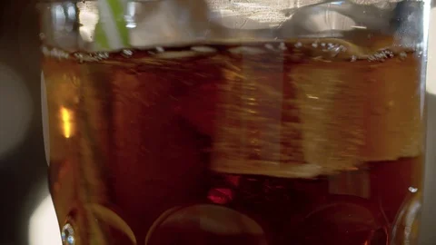 Cola stirring into the glass Stock Footage 125353458