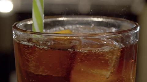 Cola stirring into the glass Stock Footage 125353922