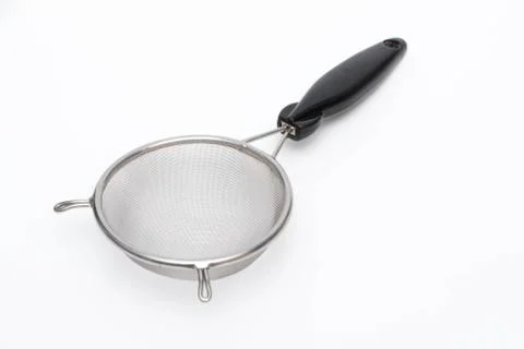 Colander with handle isolated on white background. Stock Photos