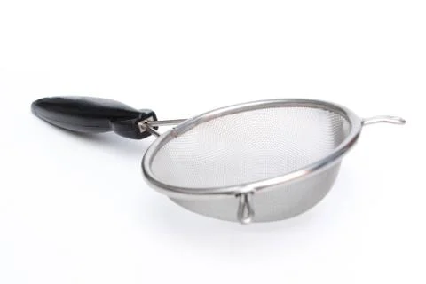 Colander with handle isolated on white background. Stock Photos