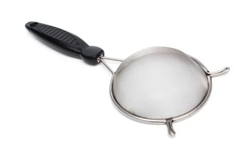 Colander with handle isolated on white background. Stock Photos