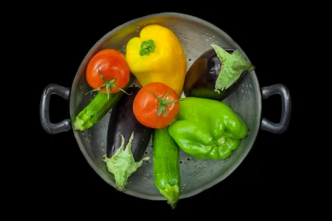 Colander with vegetables Stock Photos
