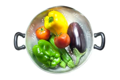 Colander with vegetables Stock Photos