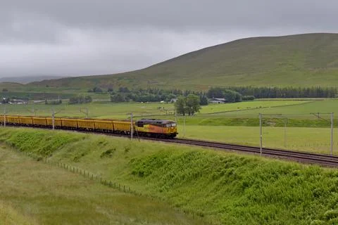 Colas Rail Freight 56105 with empty aggregate wagons heading north Stock Photos