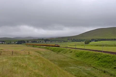 Colas Rail Freight 56105 with empty aggregate wagons heading north on WCML Stock Photos