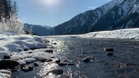 Cold Alaska Stream In Winter With Sun Sparkling on water Stock Footage 302597187
