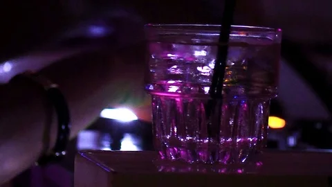 Cold alcoholic drink on table while DJ Playing Stock-Footage 105488544