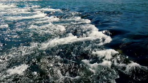 Cold and fast mountain river passing around rock and making white foam Video stock 141160115