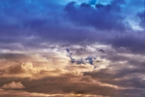 Cold and warm light in the clouds, meeting of a cold and warm cyclone, weathe Stock Photos