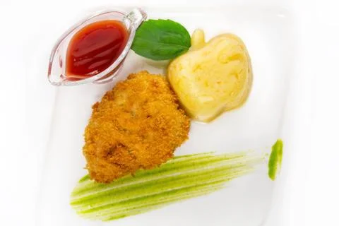 Cold appetizer of fish, vegetables on toast. On a white plate Foto stock