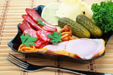 Cold appetizers on a plate Stock Photos