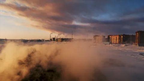 Cold arctic city experiencing extreme winter weather at sunset Stock Footage 337021034