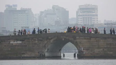 Cold autumn day China, difference between historic bridge and new Hangzhou city Stock Footage 60412196