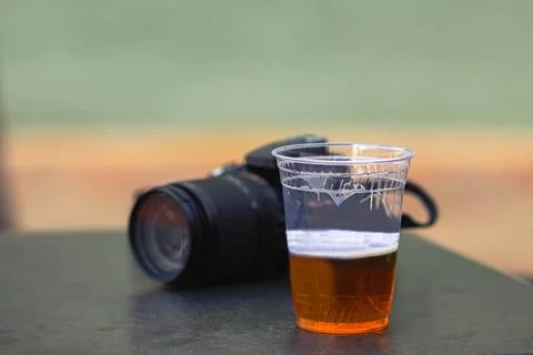 A cold beer and camera Stock Photos