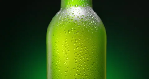 Cold Beer Bottle With Condensation Droplets on the glass background Stock Footage 338427299