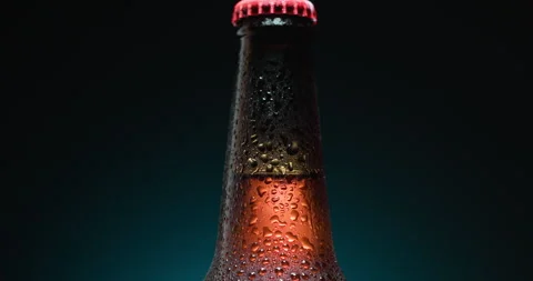 Cold Beer Bottle With Condensation Droplets on the glass background Stock Footage 339012411