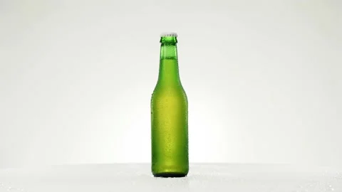 Cold beer bottle with drops rotates 360 degrees Stock Footage 153264581
