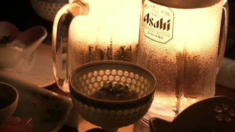 Cold beer with bubbles and condensation in a cozy setting, HD 動画素材 171584474