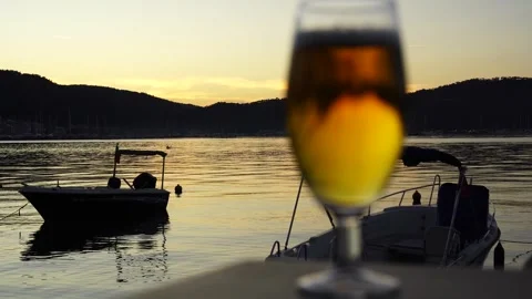 Cold Beer Glass with Bubbles to Beautiful Sunset Sea View, Fethiye Stock Footage 324533391