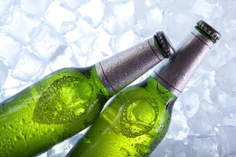 Cold beer in ice Stock Photos