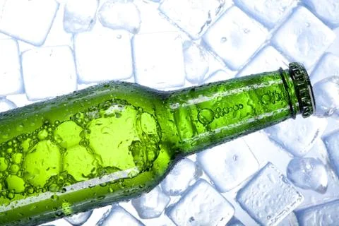 Cold beer in ice Stock Photos