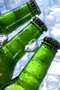 Cold beer in ice Stock Photos