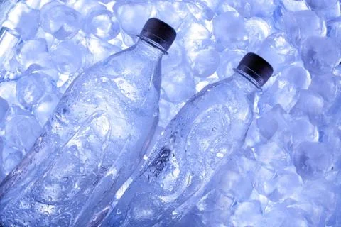 Cold beer in ice Stock Photos