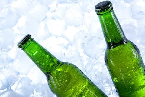 Cold beer in ice Stock Photos