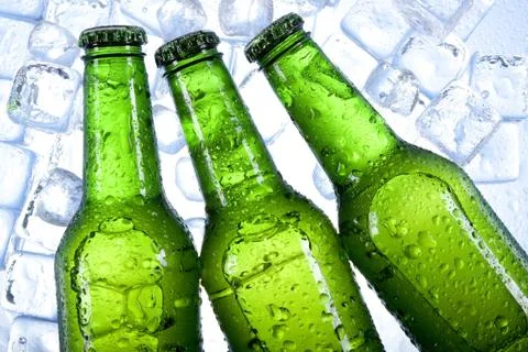 Cold beer in ice Stock Photos